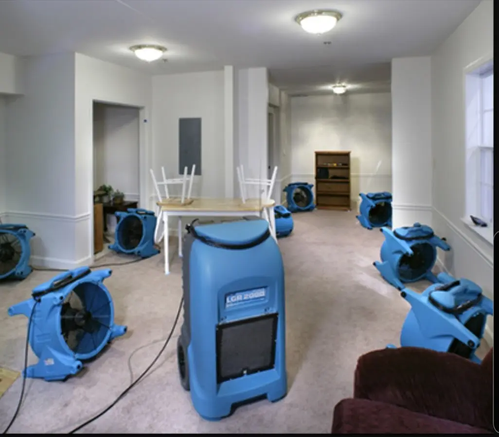 Air movers and dehumidifier setup for Water Damage Restoration in Murray